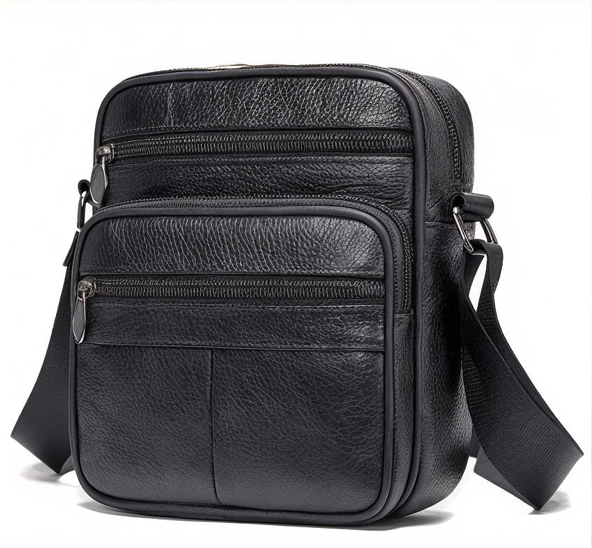 Black leather crossbody bag with multiple compartments on a white background