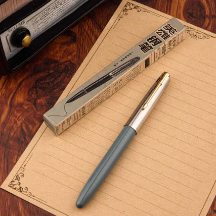Pen with packaging on a wooden surface