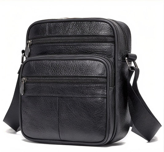 Black leather crossbody bag with multiple compartments on a white background