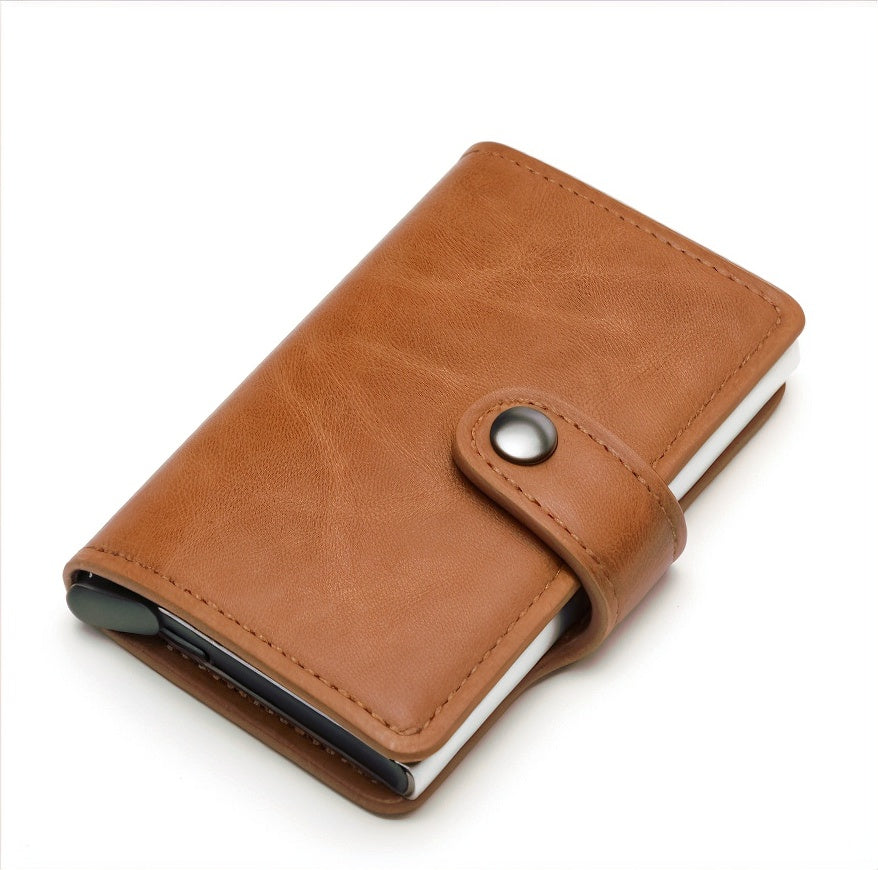 Brown leather wallet with a metallic button on a white background