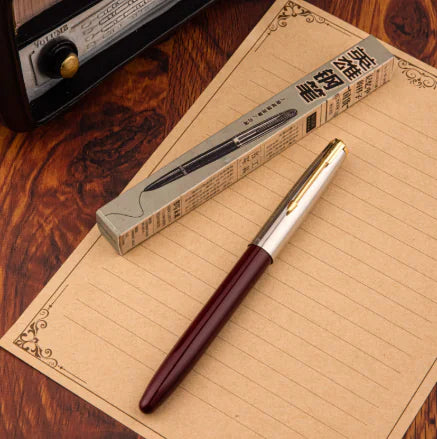 Pen with packaging on a wooden surface